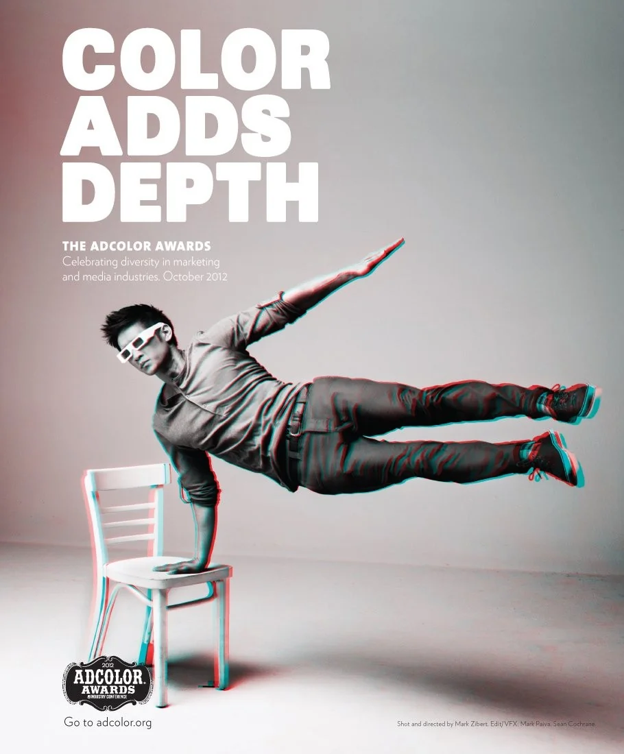 Color Adds Depth campaign poster showing a man balancing horizontally on a white chair with a red-cyan effect.